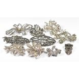 Five silver brooches and a silver clip, all set with marcasite (67g), two Exquisite brooches set