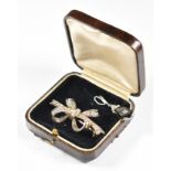 A c1920 silver brooch in the form of a bow set with baguette and round cut diamonds (5.7g, 4.3cm)