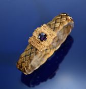 Victorian 14k gold bracelet of woven plaited design, the clasp with applied floral decoration and
