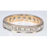 A 9ct gold eternity ring set with diamonds (two diamonds missing), 2.6g, size M/N