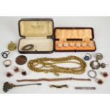 A collection of jewellery including gold plated guard chain, Victorian locket, silver ring, cut