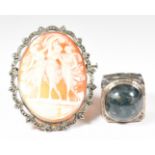A 1970s silver ring set with a moss agate cabochon, and a silver brooch set with a cameo depicting