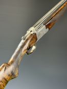 Browning B25 B2G 12 bore over and under ejector shotgun with engraved scenes of birds to the