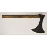 An executioner's axe with later handle, the head 32 x 25cm, the handle 68cm. PLEASE NOTE: WE ARE NOT