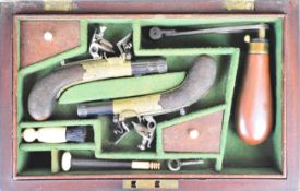 A pair of flintlock pocket pistols attributed to Joseph Egg & Sons each with engraved brass round