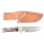 Unnamed hunting knife with horn or similar and brass handle and 12cm Damascus blade, in leather