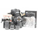 Olympus OM-1 35mm SLR camera outfit with Zuiko  1:3.5 f=28mm, 1:1.8 f=50mm and 1:3.5 f=135mm lenses,
