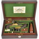 A pair of flintlock pocket pistols attributed to Joseph Egg & Sons each with engraved brass round
