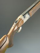 Beretta 692 12 bore over and under ejector shotgun with named locks and underside, chequered semi-