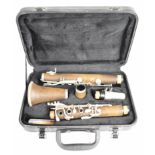 Wooden clarinet marked Rhapsody, E0546D, in fitted case.