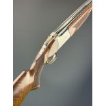 Browning 325 12 bore over and under ejector shotgun with named and engraved action and underside,