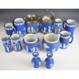 Wedgwood navy blue and lilac Jasperware including biscuit barrels, platters, jugs, vases etc,