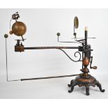 Hand cranked orrery featuring the earth with moon and four further planets, with candle holder