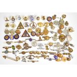 More than seventy military sweetheart brooches, pin badges, buttons, regimental badges, etc