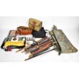 A collection of gun and shooting related items comprising a shotgun cartridge bag, two canvas and