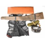 A collection of shotgun and shooting related items comprising a leather bound gun case containing