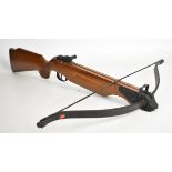 Barnett Wildcat crossbow with wooden stock, chequered semi-pistol grip and adjustable sights.