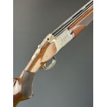 Browning B525L 12 bore over and under ejector shotgun with engraved scenes of birds to the action,