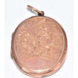 A 9ct gold back and front locket with scrolling decoration, 6.3g, 2.5 x 3.2cm