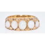 An 18ct gold ring set with five oval opal cabochons and eight diamonds, 6.8g, size I