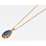 A 9ct gold pendant set with a pear cut black opal doublet, on 9ct gold mariner's link chain, 6.5g,