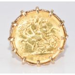 A 9ct gold ring set with a 1913 gold half sovereign, 8.9g, size P