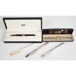 Five pens comprising two Montblanc fountain pens, Montblanc ballpoint pen, Must de Cartier