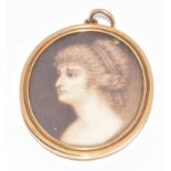 Victorian locket (tests as 18ct gold) set with an ivory portrait miniature depicting a young