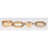Four 9ct gold rings comprising signet ring, buckle ring, damaged mourning ring and eternity ring set