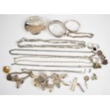 A collection of silver jewellery including two charm bracelets with over fourteen charms including