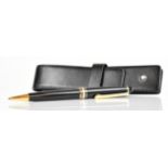 Montblanc ballpoint pen with black resin barrel and cap and gold plated fittings, in original case.
