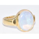 An 18ct gold ring set with an opal cabochon, 5.7g, size P