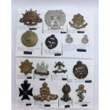 A collection of fifteen assorted cap badges, to regiments including Cambridgeshire, 9th Queens Royal