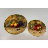 Two Royal Worcester fruit plates, they feature hand painted fruits on a mossy bank with a shaped
