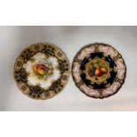 Two Royal Worcester cabinet plates by R Sebright. The first features a hand painted centre with