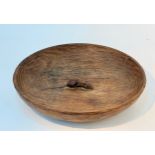 A Robert Mouseman Thompson adzed oak fruit bowl, with carved mouse to centre 29.5cm diameter