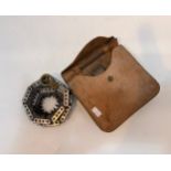 Vintage folding chain saw in leather case