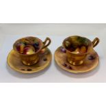 Two Royal Worcester teacups and saucers, 1930s, decorated with fruit, impressed and puce printed