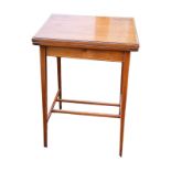 A SMALL EDWARDIAN SATINWOOD FOLD-OVER CARD TABLE With green baize top, on slender square taper