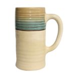 CLARICE CLIFF, AN ART DECO POTTERY TANKARD/JUG Hand painted decoration of concentric bands, marked