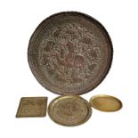 A LARGE EARLY 20TH CENTURY PERSIAN COPPER CHARGER TRAY Equestrian warrior with exotic birds and