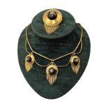 A VICTORIAN YELLOW METAL GARNET AND DIAMOND ETRUSCAN REVIVAL PENDANT NECKLACE AND BROOCH SET