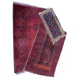 AN AFGHAN KHAL MOHAMMADI RUG, TOGETHER WITH A SMALLER AFGHAN ERSARI RUG AND A PRAYER RUG. (Khal