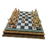 COMPTON AND WOODHOUSE, AN ELABORATE GILT METAL AND ENAMELLED CHESS SET The golden treasures of