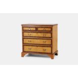 A George III bird’s-eye maple chest of drawers, late 18th century and later,
