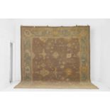 An Oushak wool carpet, of recent manufacture,