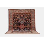A wool carpet of antique Persian Heriz design, of recent manufacture,