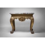A George II carved giltwood side table in the manner of William Kent, circa 1735, possibly Irish,