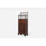 A George III mahogany secretaire cabinet, circa 1770,