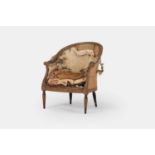 A George III upholstered bergère armchair in the manner of Thomas Chippendale, c.1770,